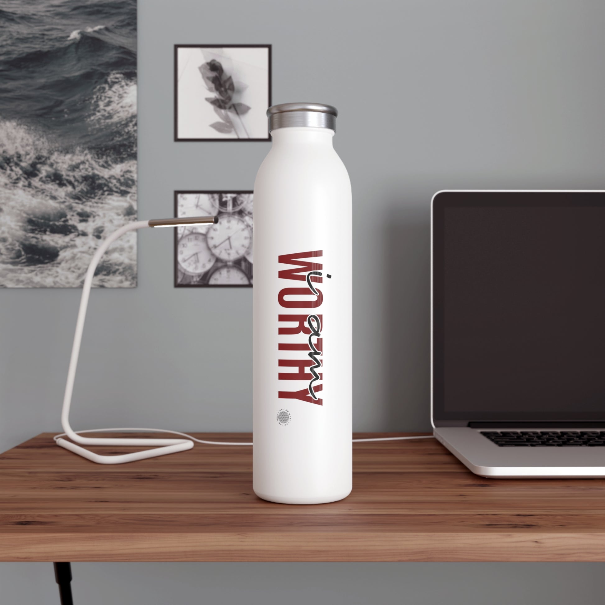 Our I Am Worthy Slim Water Bottle is the perfect way to stay hydrated on the go. This sleek and stylish bottle is made from durable stainless steel and features a double-walled vacuum insulation to keep your drinks cold for up to 24 hours.