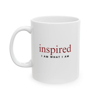 White mug with 'inspired I AM WHAT I AM' text on a white background