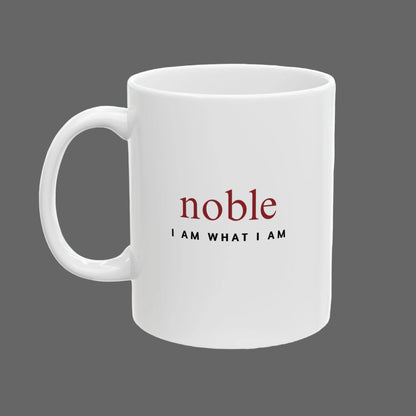 White mug with 'noble I AM WHAT I AM' text on a white background