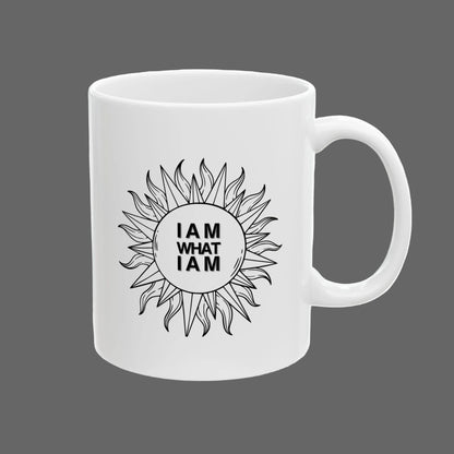 White mug with sunflower design and 'I AM WHAT I AM' text on a white background