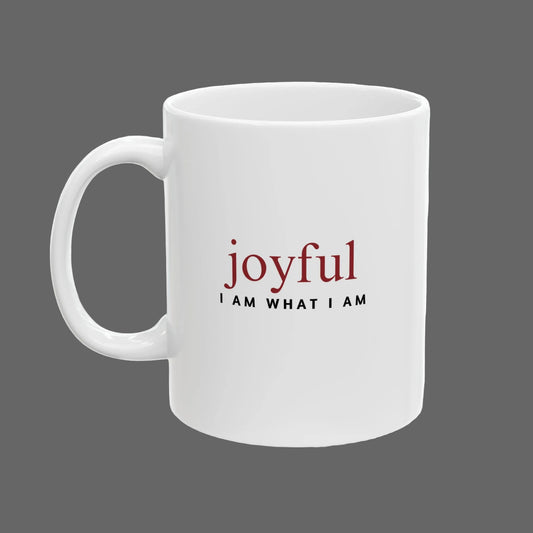 White mug with 'joyful I AM WHAT I AM' text on a white background