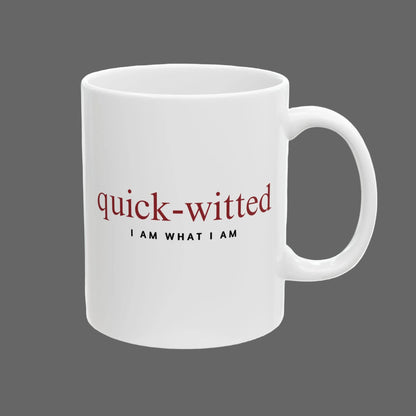 White mug with red and black text on a white background