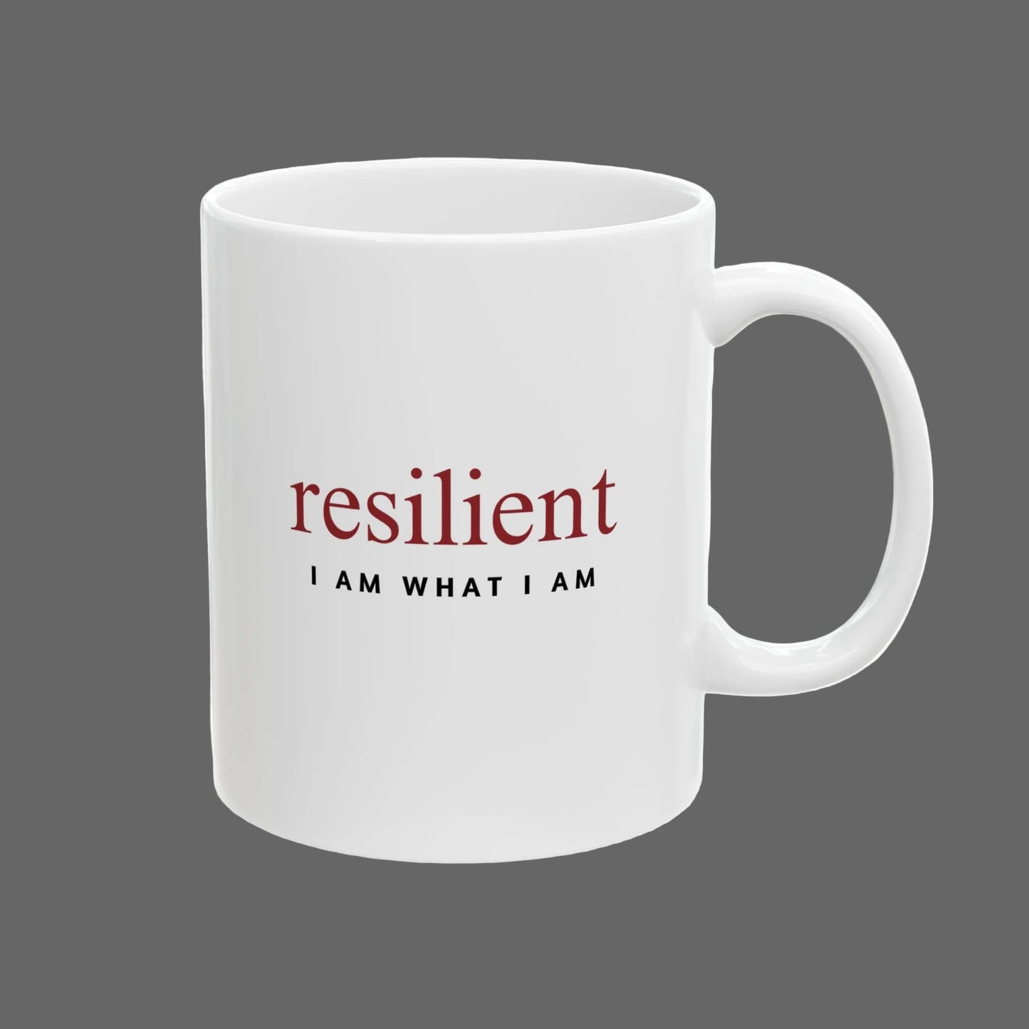 White mug with motivational text 'resilient I AM WHAT I AM' on a white background