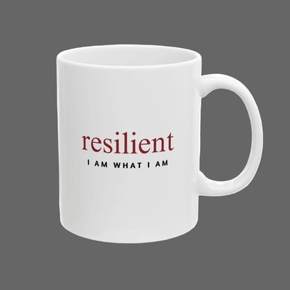 White mug with motivational text 'resilient I AM WHAT I AM' on a white background