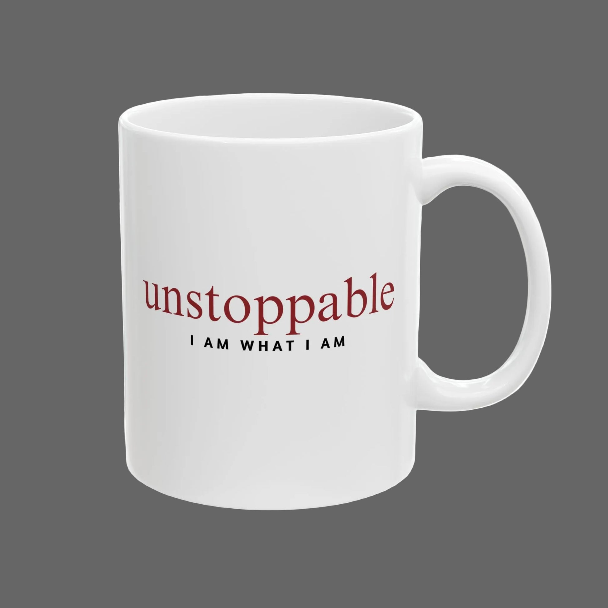 White mug with 'unstoppable I AM WHAT I AM' text on a white background