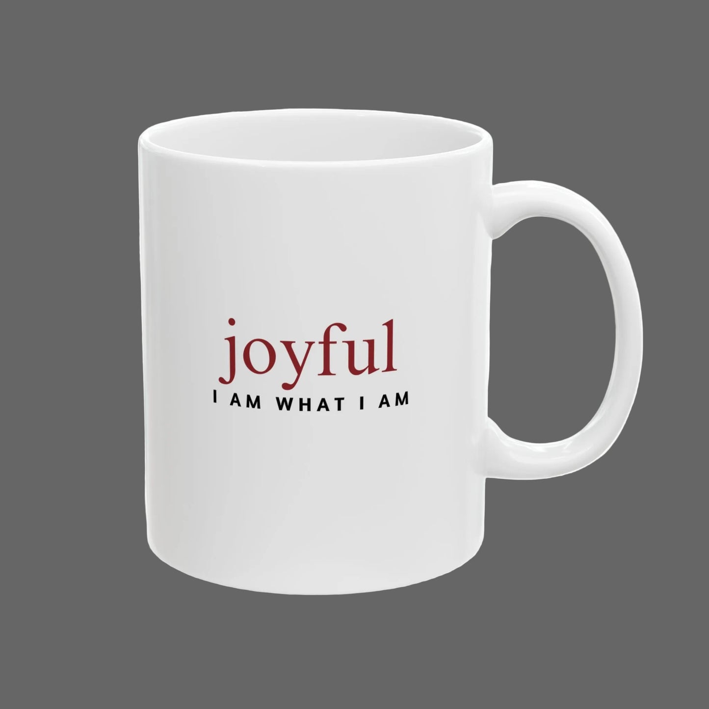White mug with 'joyful I AM WHAT I AM' text on a white background