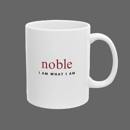 White mug with 'noble I AM WHAT I AM' text on a white background