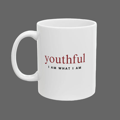 White mug with 'youthful I AM WHAT I AM' text on a white background