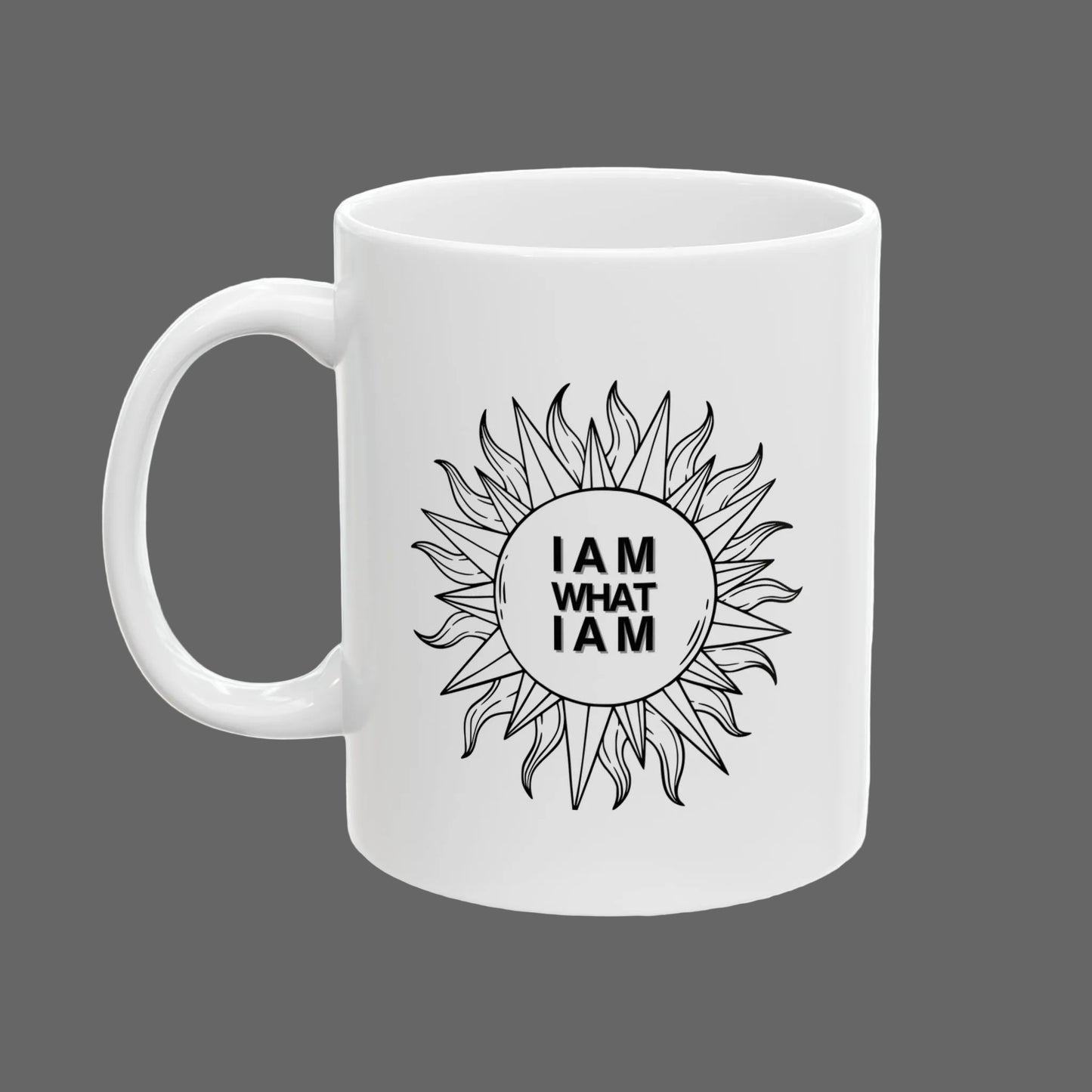 White mug with sunflower design and 'I AM WHAT I AM' text on a white background