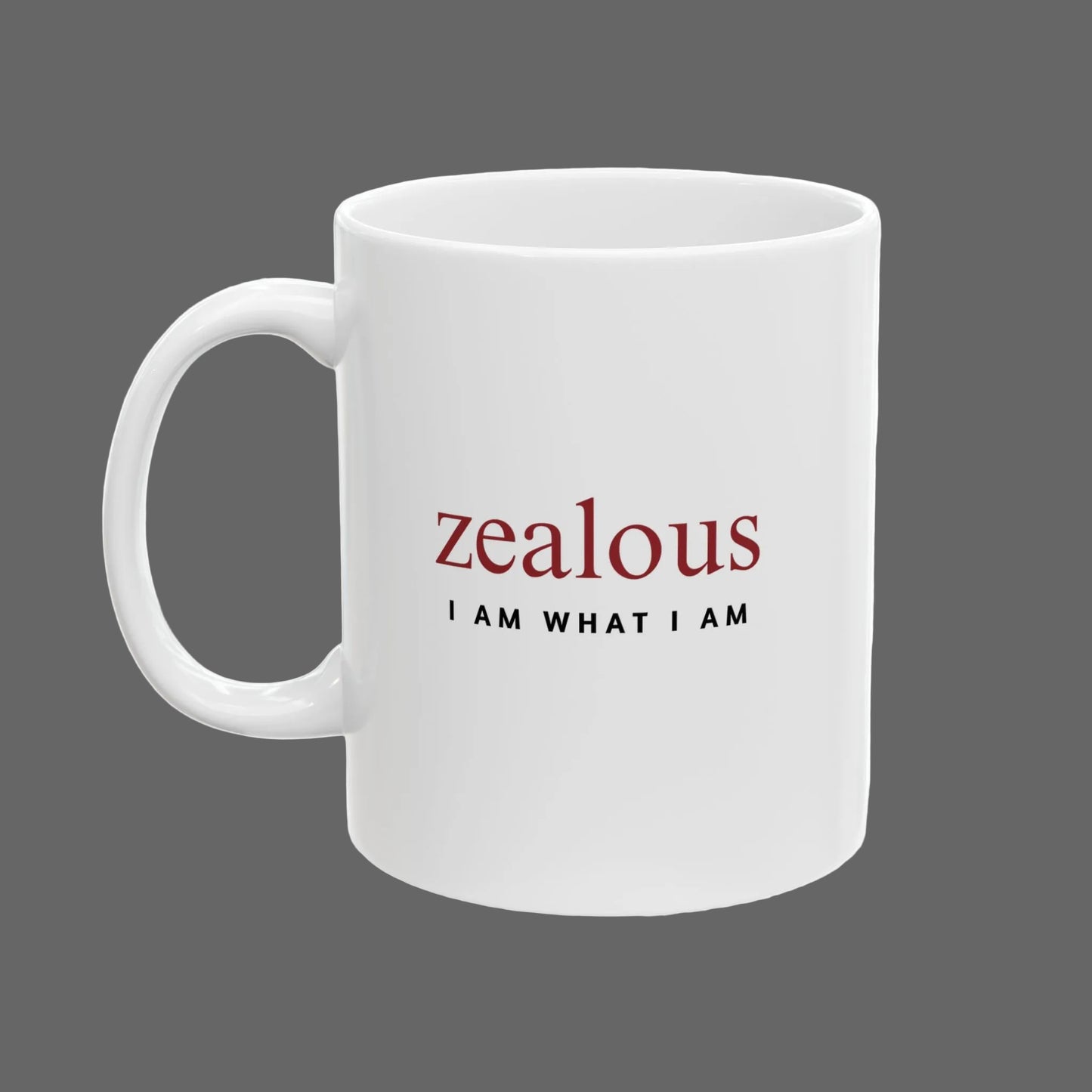 White mug with 'zealous I AM WHAT I AM' text on a white background