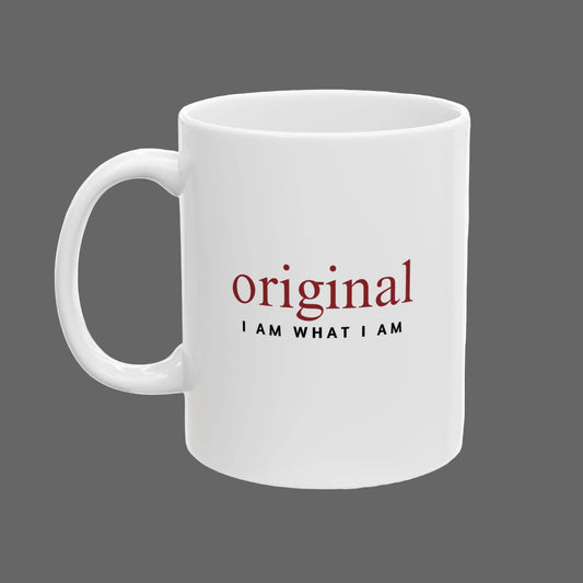 White mug with motivational quote 'original I AM WHAT I AM' on a white background