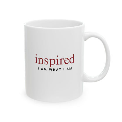 White mug with 'inspired I AM WHAT I AM' text on a white background