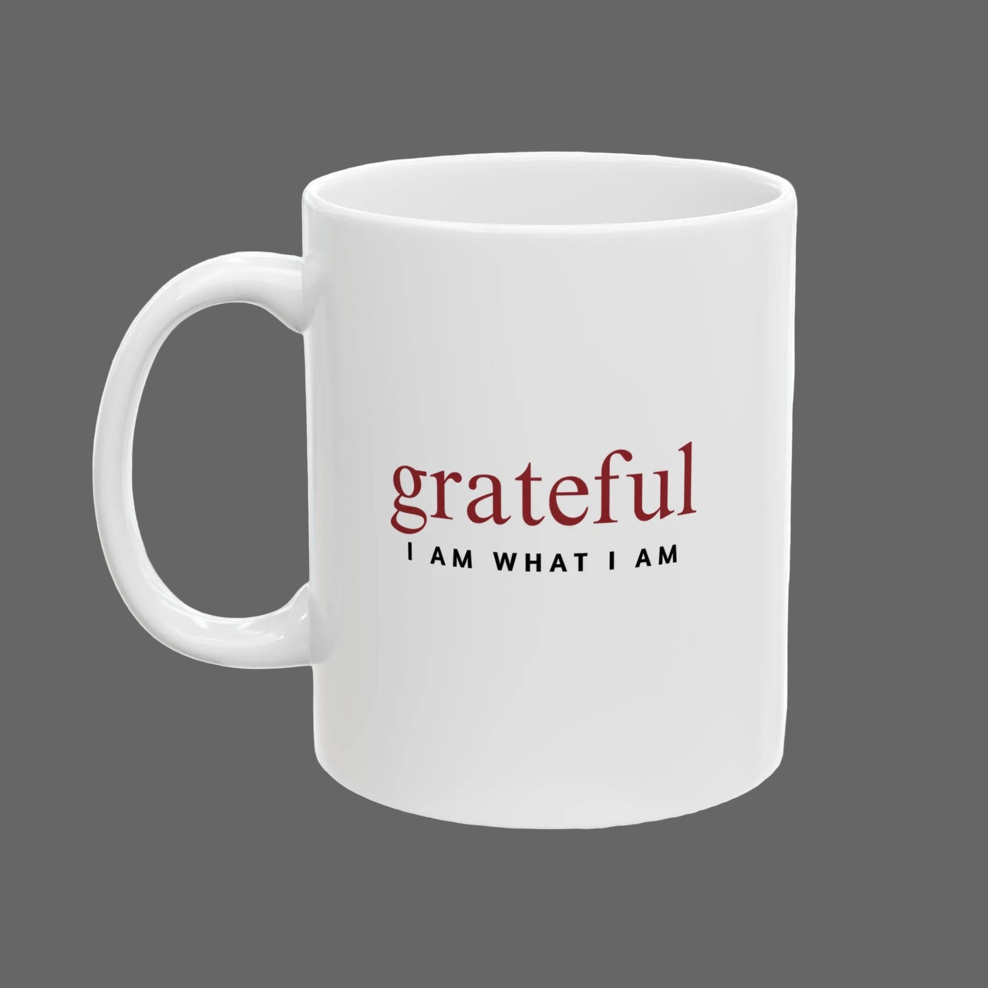 White mug with 'grateful I AM WHAT I AM' text on a white background
