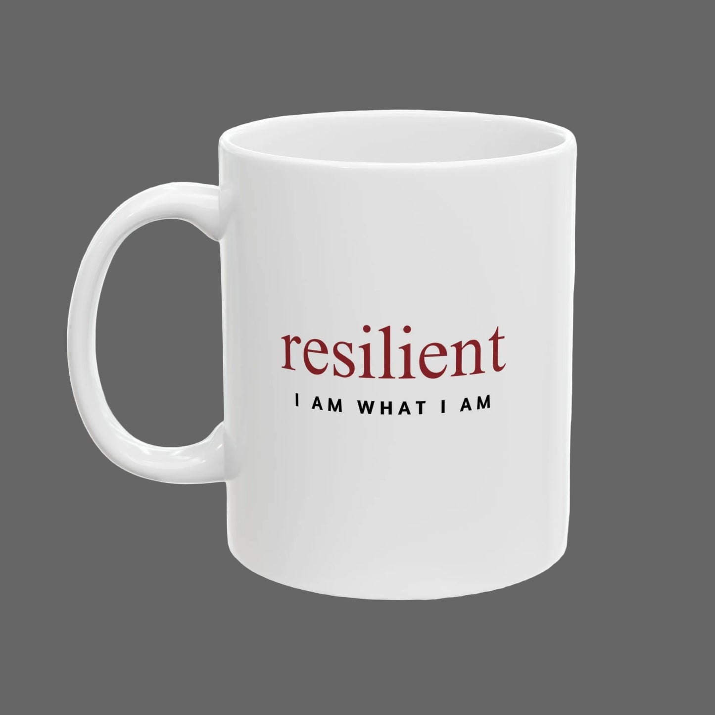 White mug with 'resilient I AM WHAT I AM' text on a white background