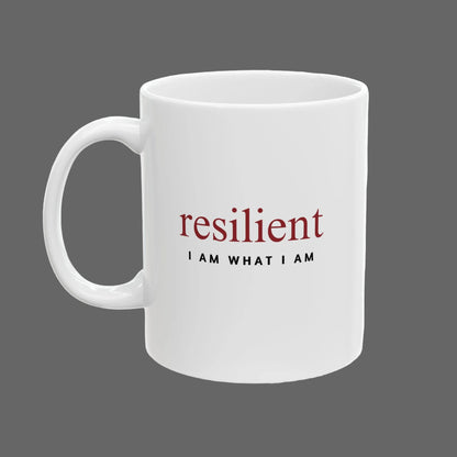 White mug with 'resilient I AM WHAT I AM' text on a white background
