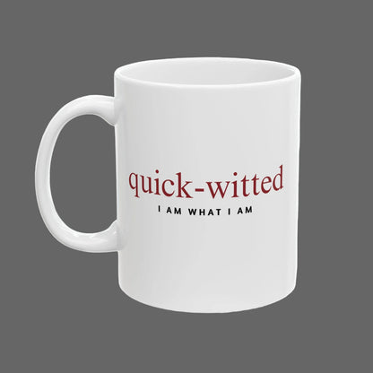 White mug with 'quick-witted I AM WHAT I AM' text on a white background