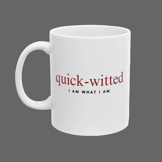 White mug with 'quick-witted I AM WHAT I AM' text on a white background
